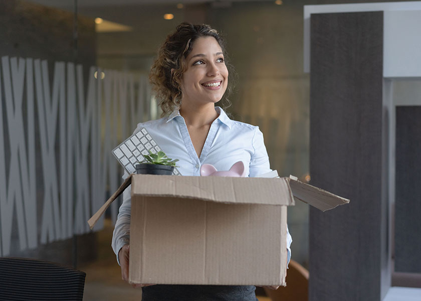 Smiling woman leaving job